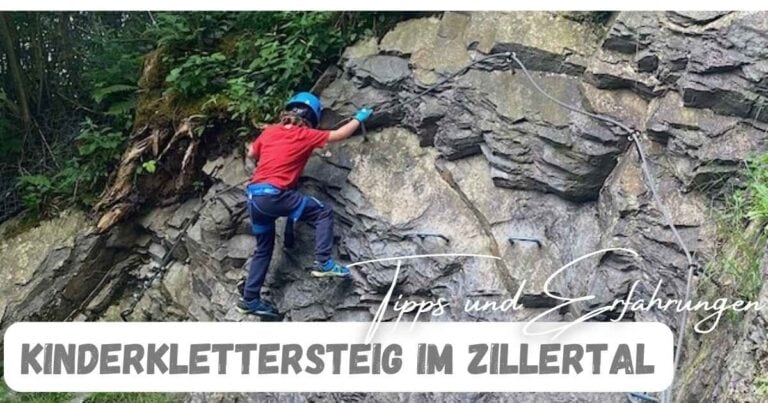 Bergsteigerkind beim Klettern am Felsen im Zillertal, Kinderklettersteig mit Sicherheitsausrüstung.und Erfahrungen und einem Kind, das gerade einem Felsen hoch klettert.