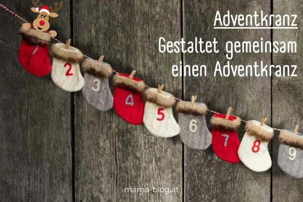 ein hängender Adventskranz mit einem Elch auf der Nummer eins und dem Text: Adventskranz gestalten mit der Familie