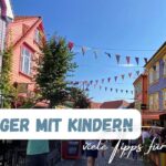 Stavanger mit Kindern als Text und im Bild die Ovre Holmegate mit vielen bunt bemalten Hausfronten