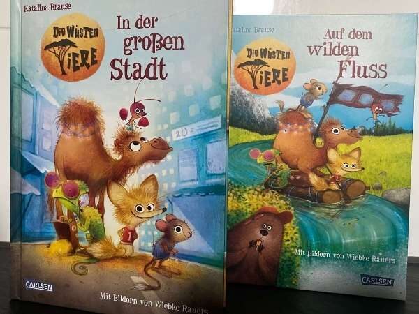 Fröhliche Tiere aus der "Die wilden Tiere" Buchreihe in bunten Szenen, ideal für Kinderbücher und Tierliebhaber, mit Illustrationen von Wiebke Rauers.