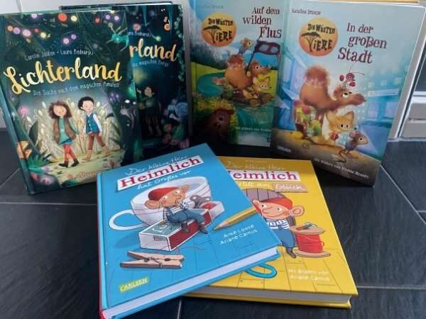 6 Buchcover von den Büchern Lichterland, die Wüsten Tier und H err Heimlich