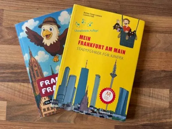 Ein Kinderstadtführer für Frankfurt am Main mit bunten Illustrationen und bekannten Wahrzeichen, ideal für kleine Entdecker und Familien.