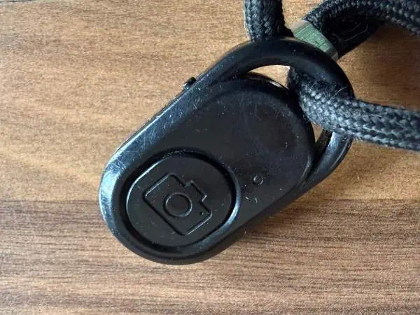 Sicherheitsgurtverschluss mit Kamera-Symbol, geeignet für Kinderautositze, für sichere Befestigung und Schutz im Auto.