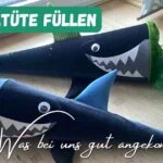 Bunte Schultüten in Form von Haien, ideal für den Schulanfang, mit grüner Tüte und buntem Tüll, perfekt für Kinder, die den Schulstart feiern.